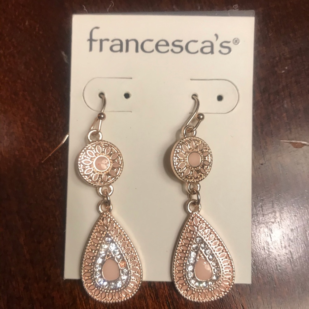Francesca’s gold earrings with matching bracelet